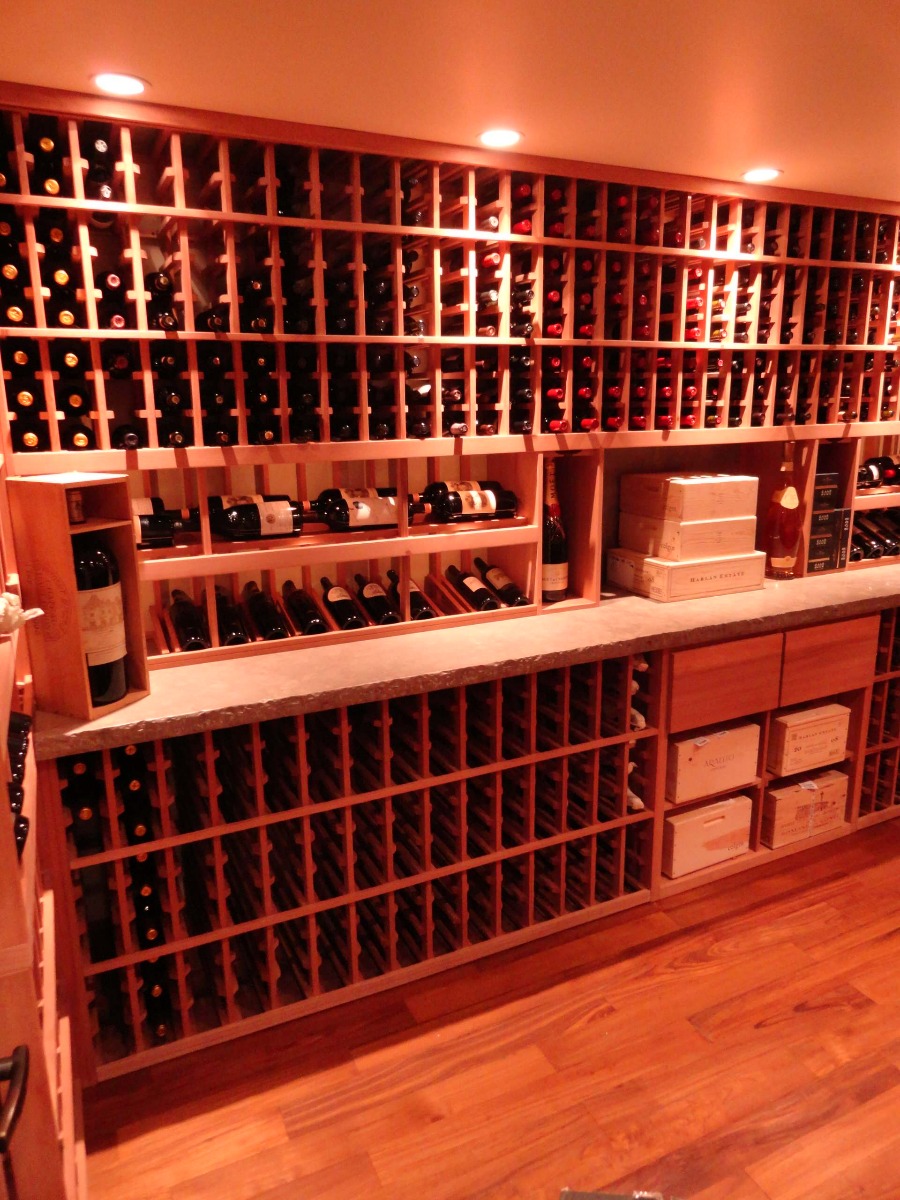 Another view of large bottle storage with minimal wine displays and case storage