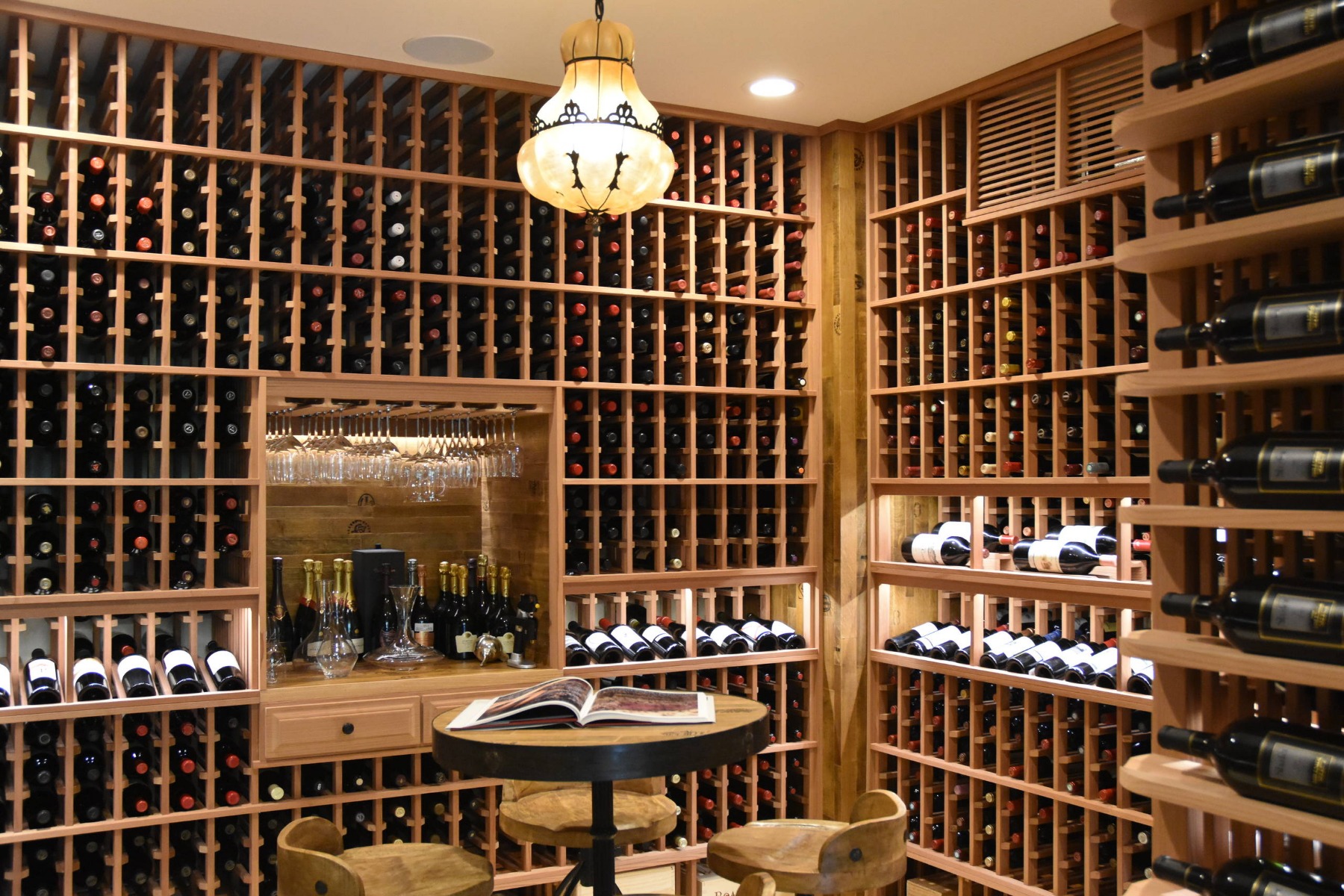 Gorgeous custom wine cellar acts as a dramatic entry piece as you walk into this beautiful home