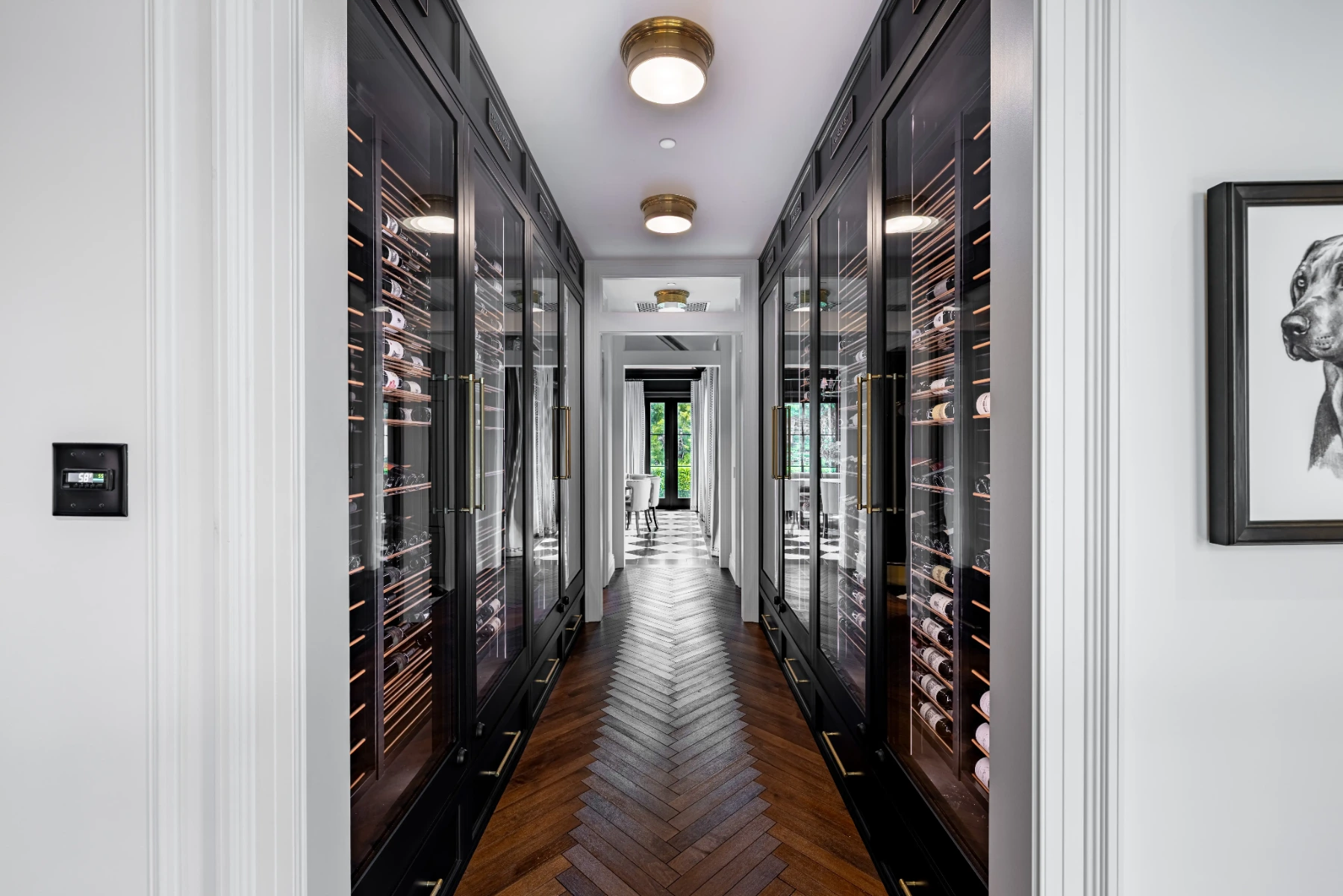 La Jolla hallway wine cellar with visible temperature control panel