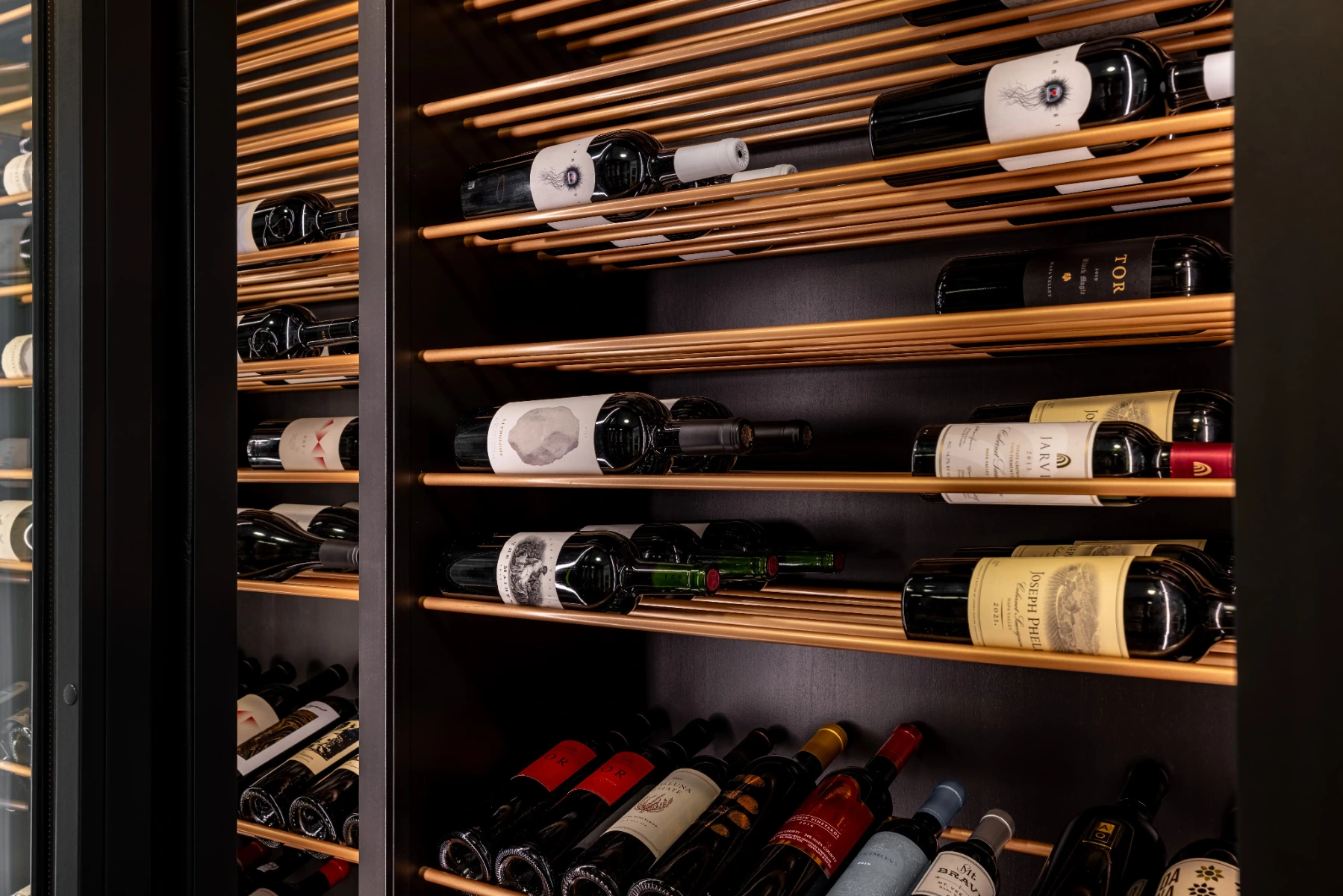 Label-forward wine bottles on gold-toned VintageView metal rods
