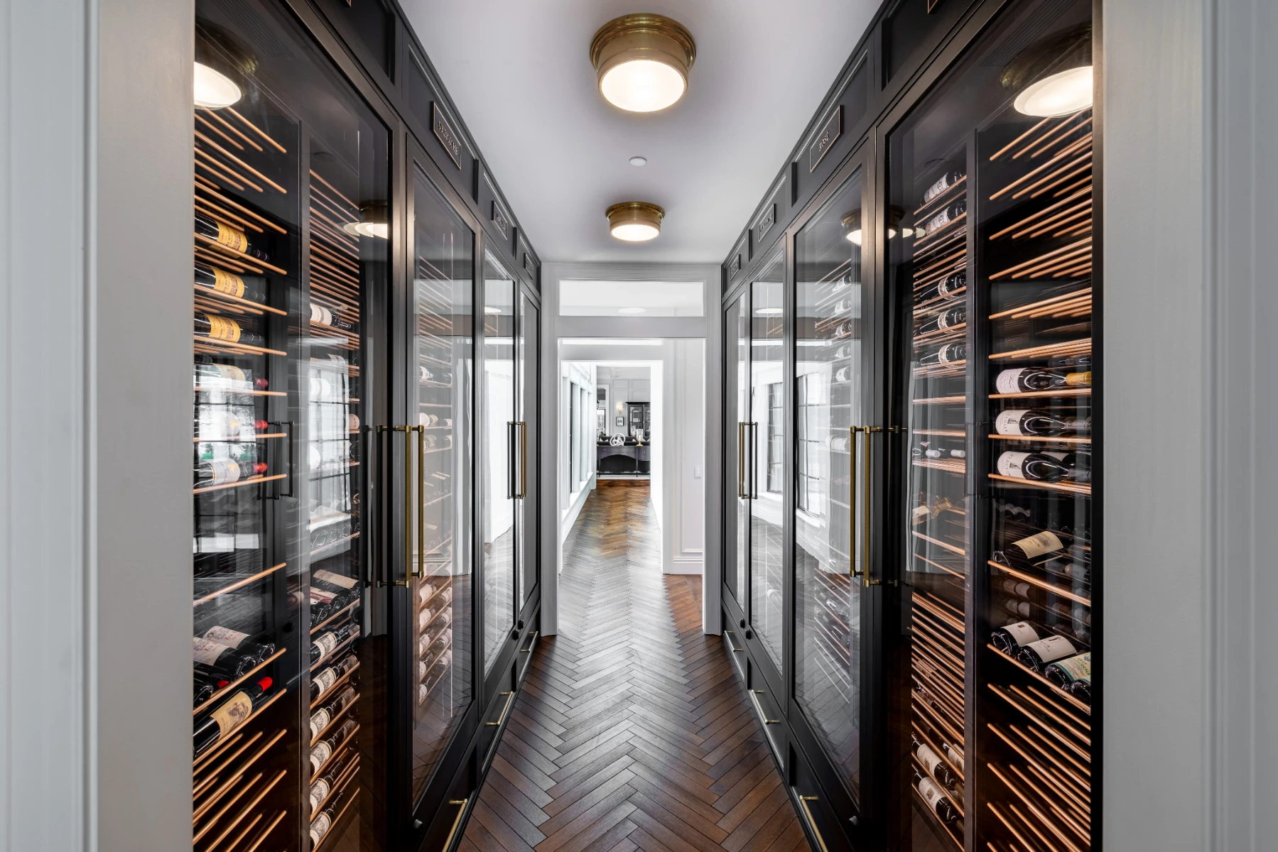 Opposing wine walls in a La Jolla hallway wine cellar