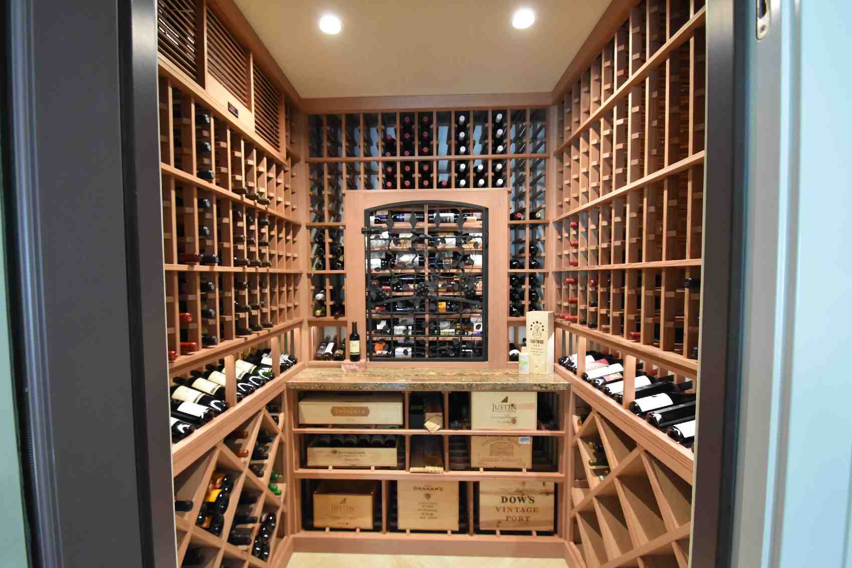 Laguna Hills Orange County Small Custom Wine Cellar with Wrought Iron Door