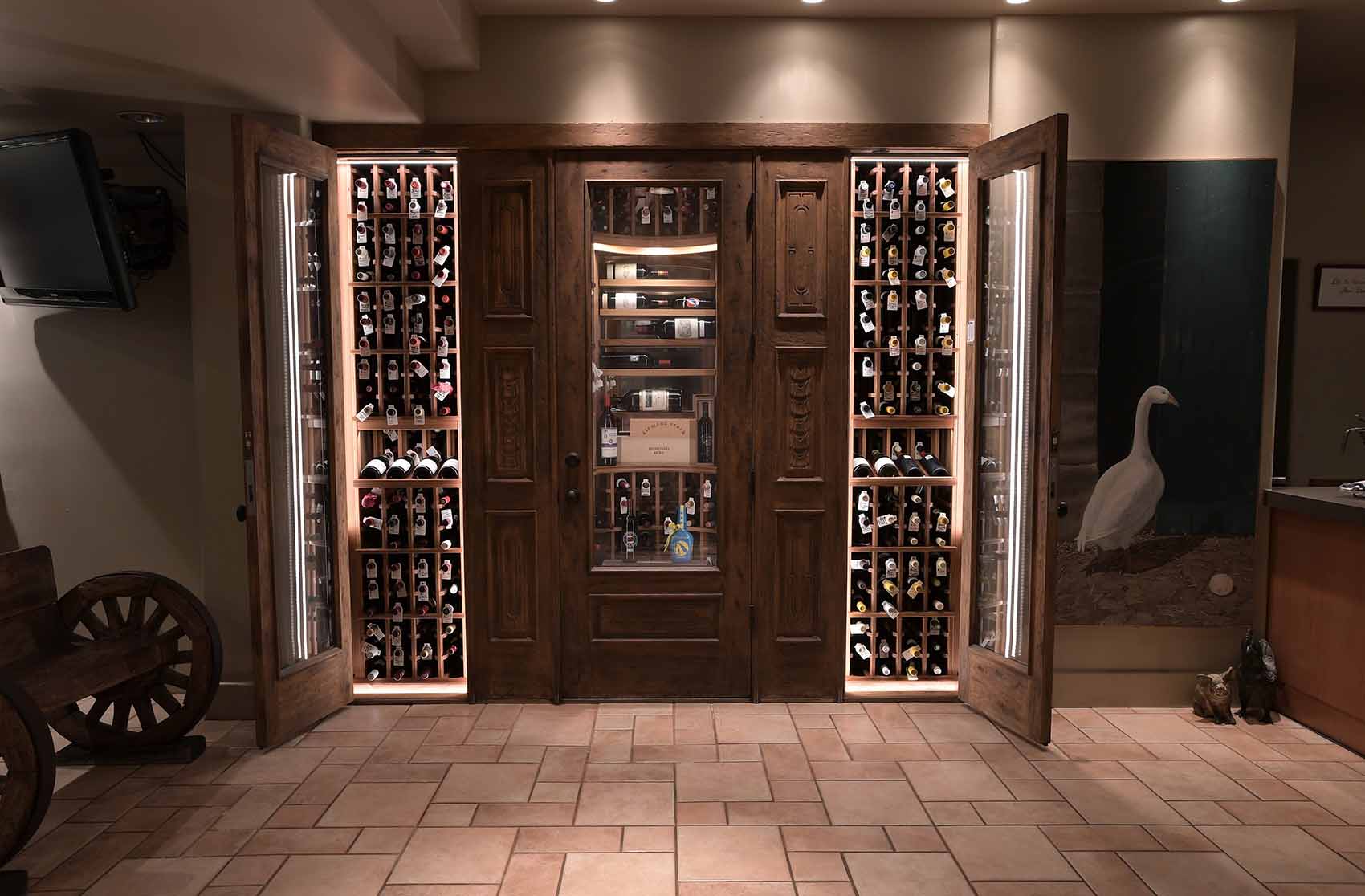 LED lighting enhancing the showcasing ability of this small wine cellar